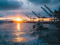 Tow boat in port at sunset