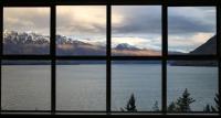 A window, lake, and mountaints