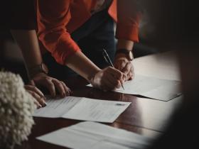 signing-papers-table.jpg